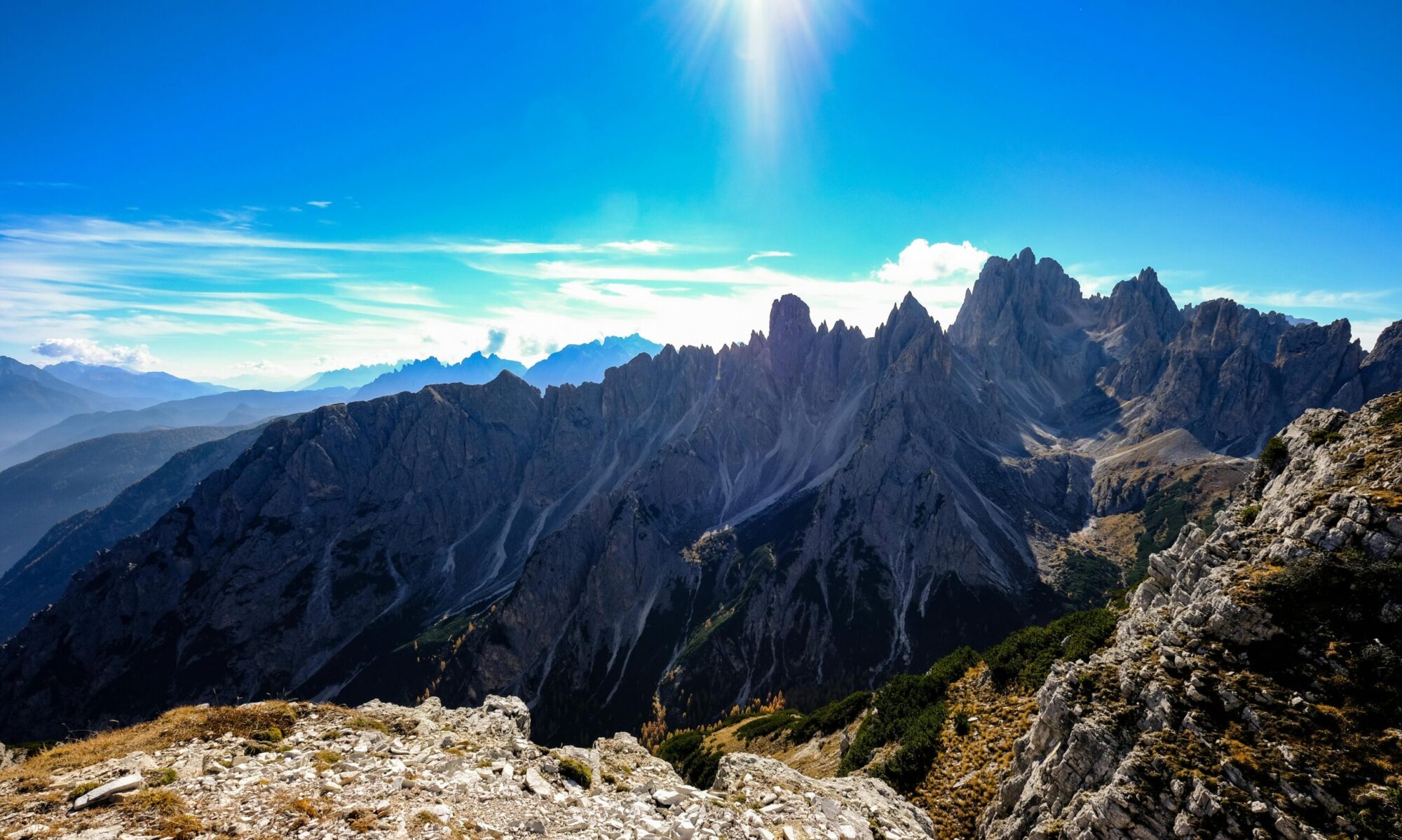 Breathtaking view of the Dolomites mountain peaks under a clear blue sky, perfect for adventure and nature enthusiasts.